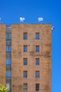 Jerusalem Israel 12-052019 View of a tall stone building with windows and balconies and Israeli flags on the roof, from the side, Royalty Free Stock Photo