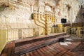 A wide-angle view of the huge and traditional golden menorah lying in the Western Wall plaza in Jerusalem