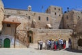 JERUSALEM - May 22: A group of tourists listening to a guide near the Church of the Holly Sepulcher