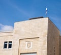 The Jerusalem`s emblem and Israeli flag on an building in old city Royalty Free Stock Photo