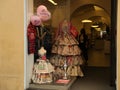 JESI, ITALY - MAY 17, 2022: Beautiful dresses made of newspapers in boutique, view from outside