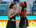 Jessica Pegula (L) and Coco Gauff of USA pose with the trophy after the women's doubles final at 2023 Miami Open