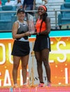 Jessica Pegula (L) and Coco Gauff of USA pose with the trophy after the women\'s doubles final at 2023 Miami Open