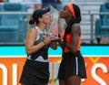 Jessica Pegula (L) and Coco Gauff of USA pose with the trophy after the women's doubles final at 2023 Miami Open