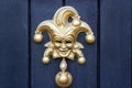 Jester or Harlequin mask as a door knocker Royalty Free Stock Photo