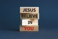Jesus believe in you symbol. Concept words `Jesus believe in you` on wooden blocks on a beautiful grey background. Businessman