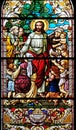 Jesus blesses mothers with children, stained glass window in the St John the Baptist church in Zagreb, Croatia