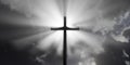 Jesus Christ christian crucifix or cross in front of stormy sky with dark clouds and sun rays or streaks, god, resurrection or Royalty Free Stock Photo