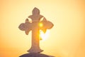 Jesus Christ cross. The Crucifixion, Resurrection and Easter concept. The Christian cross with a sunset scene in warm tone Royalty Free Stock Photo