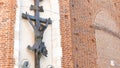 Jesus Christ on the cross figure, sculpture on Mariacki Church in Krakow, detail closeup, nobody, pan down. Christianity,