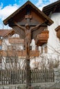 Jesus Christ crucified on wooden roadside cross, South Tyrol, Italy