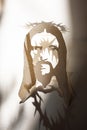 Jesus Christ face paper template and shadow with thorn crown as christian religion savior God Royalty Free Stock Photo