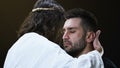 Jesus Christ hugging crying male parishioner, making satisfaction with sins