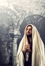 Jesus Christ prays with clasped hands Royalty Free Stock Photo