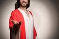 Jesus Christ reaching out his hand on beige background, closeup. Space for text Royalty Free Stock Photo