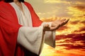 Jesus Christ reaching out his hands and praying at sunset Royalty Free Stock Photo