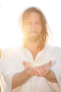 Jesus Christ Smiles From Heaven with Arms outstretched  in Light Royalty Free Stock Photo