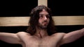 Jesus Christ in thorns crown on black background, religious faith, crucifix