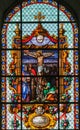 Jesus on the Cross - Stained Glass in Beguinage Church Royalty Free Stock Photo