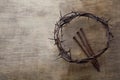 Jesus Crown Thorns and nails on Old and Grunge Wood Background. Vintage Retro Style. Free space for text Royalty Free Stock Photo