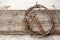 Jesus Crown Thorns and nails on Old and Grunge Wood Background. Vintage Retro Style. Royalty Free Stock Photo