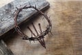 Jesus Crown Thorns and nails on Old and Grunge Wood Background. Vintage Retro Style. Royalty Free Stock Photo