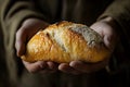 Close up of a bread on Jesus hand, a concept of Jesus feeding multitudes as in bible Royalty Free Stock Photo