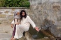 Jesus with a girl at a water well Royalty Free Stock Photo