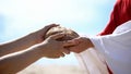 Jesus hands giving bread to poor man, biblical story to feed hungry, charity Royalty Free Stock Photo