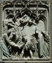 Jesus is laid in the tomb, detail of the main bronze door of the Milan Cathedral
