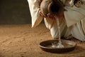 Jesus pouring water Royalty Free Stock Photo