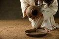 Jesus pouring water from a jar Royalty Free Stock Photo