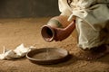 Jesus pouring water from a jar Royalty Free Stock Photo