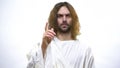 Jesus raising finger, warning against sin, teaching Christians righteous life