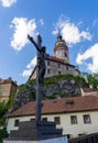 The Jesus sculpture of Cesky Krumlov with The castle in background Royalty Free Stock Photo