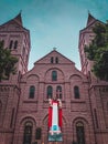 Old historical church picture and Jesus Christ statue in front with blue sky