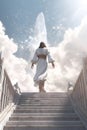 Jesus walking up Stairway podium leading to the heavenly sky towards the glowing end clouds skies landscape. enerative ai Royalty Free Stock Photo