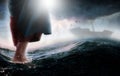 Jesus walks on water across the sea towards a boat during a storm