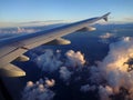 Jet Aircraft Wing, Blue Sky and White Clouds Royalty Free Stock Photo