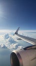 Jet airliner wing and engine viewed from the window, high above the clouds. Winglet Royalty Free Stock Photo