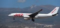 Jet2 Airlines flies in the blue sky. Landing at Tenerife Airport. El Teide volcano in the background Royalty Free Stock Photo