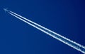 Jet Airplane contrails in blue sky background