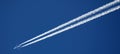 Jet airplane flying the blue sky trace of the plane Royalty Free Stock Photo