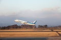 Jet airplane takes off while volcano erupts