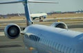 jet engine against a plane at the airport on loading Royalty Free Stock Photo