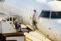 jet engine against a plane at the airport on loading Royalty Free Stock Photo