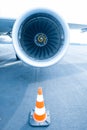 Jet engine with traffic cone in front Royalty Free Stock Photo