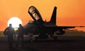 Jet fighter pilots silhoutte at sunset on military base airfield