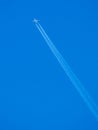 Blue sky vapour trails Royalty Free Stock Photo