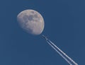 Jet flying over moon Royalty Free Stock Photo
